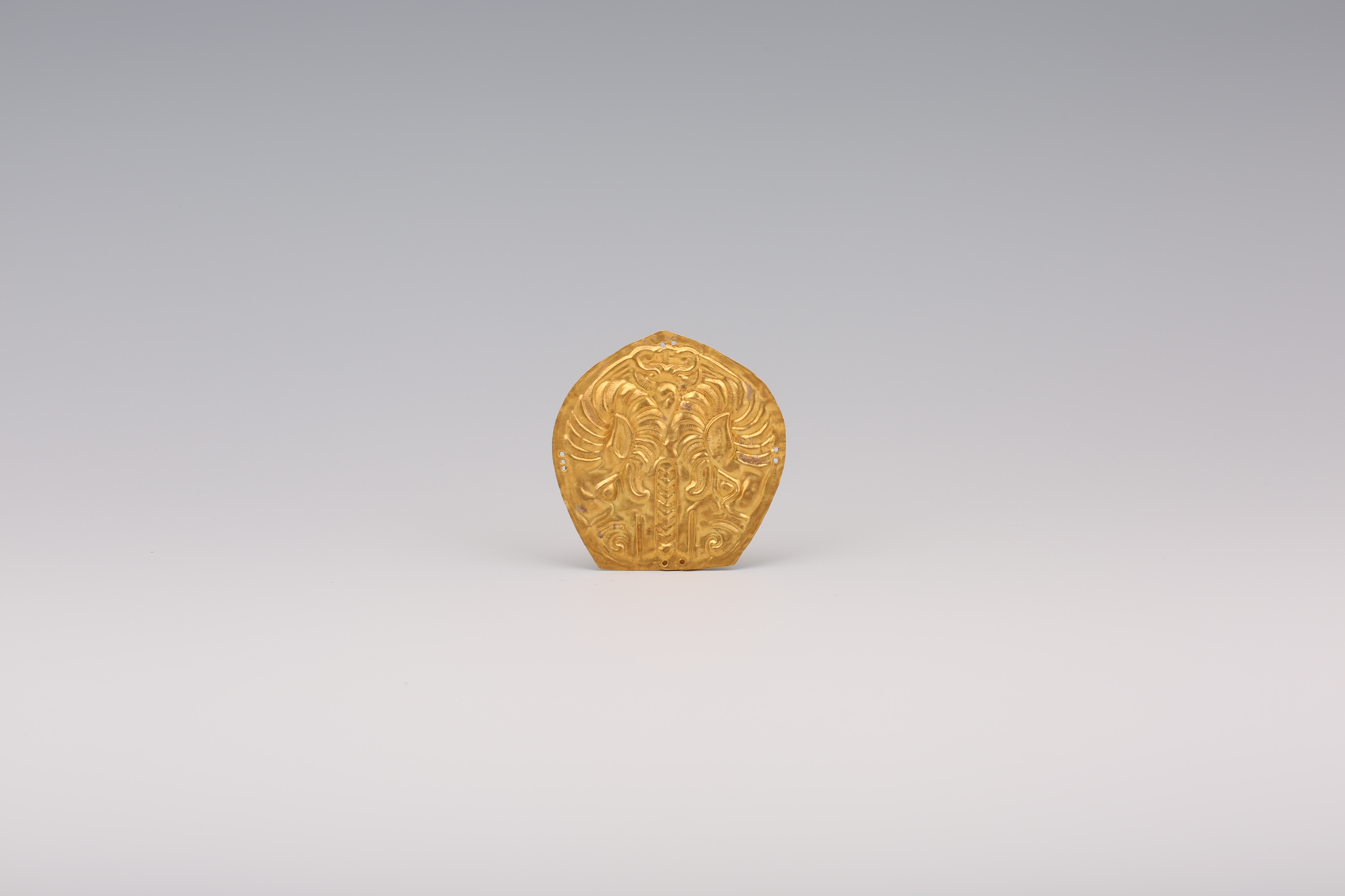 金羊面饰